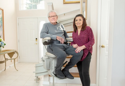 two older adults happy with new stairlift from Lifeway Mobility