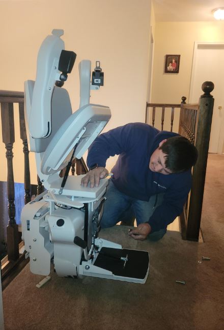 Lifeway Mobility technician professionally installing Bruno stairlift