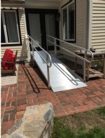 aluminum modular wheelchair ramp installed in backyard of home in Wayland Massachusetts