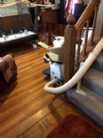 Curved stairlift wood floor carpeted stairs3
