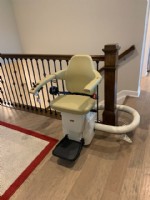 Handicare Freecurve stairlift at top park position in home in Indianapolis
