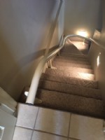 Handicare Freecurve stairlift rail mounted to stairs in Indiana home