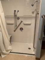 barrier free shower with grab bars and in wall shower niches