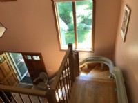 view of curved stairlift from top landing in Massachusetts home