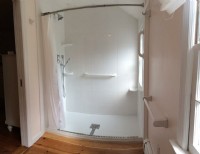 wheelchair accessible shower with grab bars
