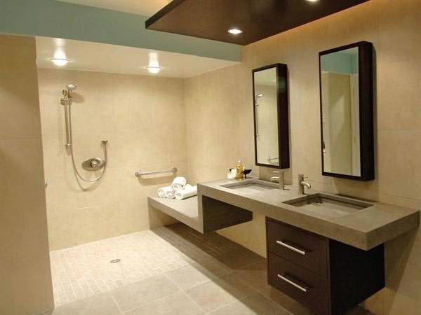 barrier free shower and vanity with two sinks and mirrors