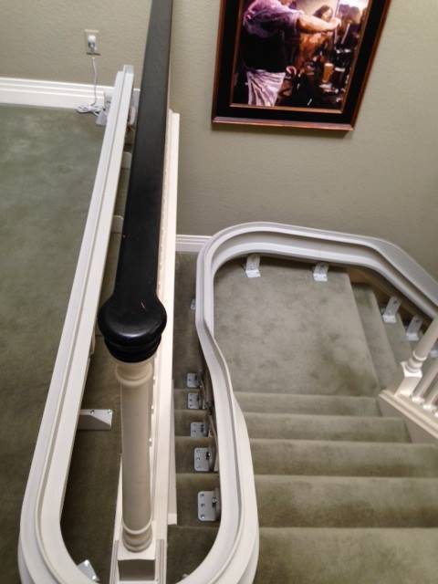 view of curved stair lift from top of steps