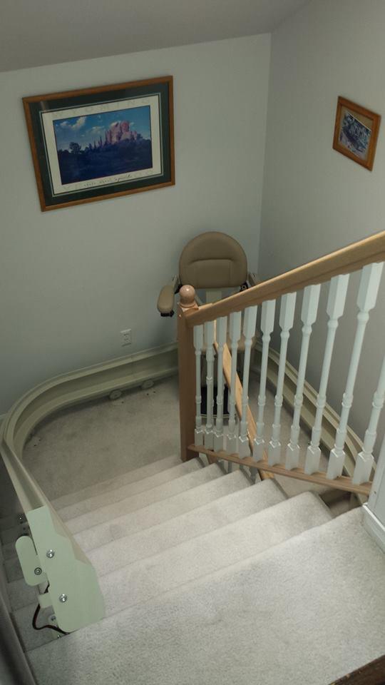 The chair seen rounding a corner of the staircase