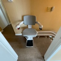 curved stairlift San Diego at top landing of stairs